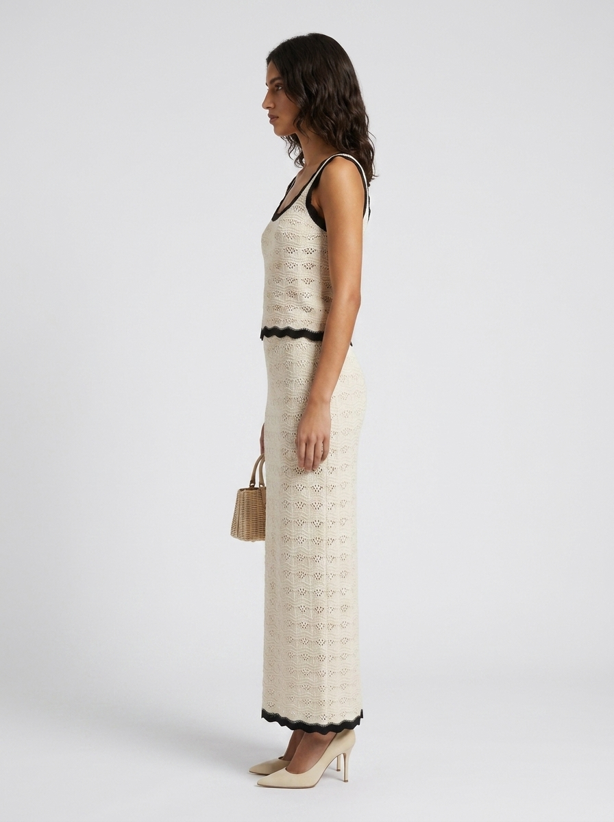 Noiré Knit Vest and Skirt Set — side profile view on model
