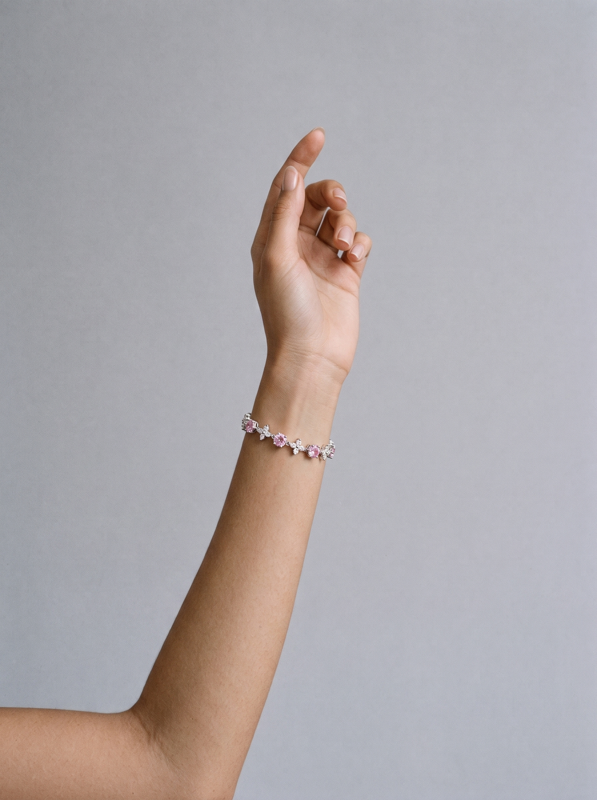 Floria Zircon Bracelet pink worn on model's wrist