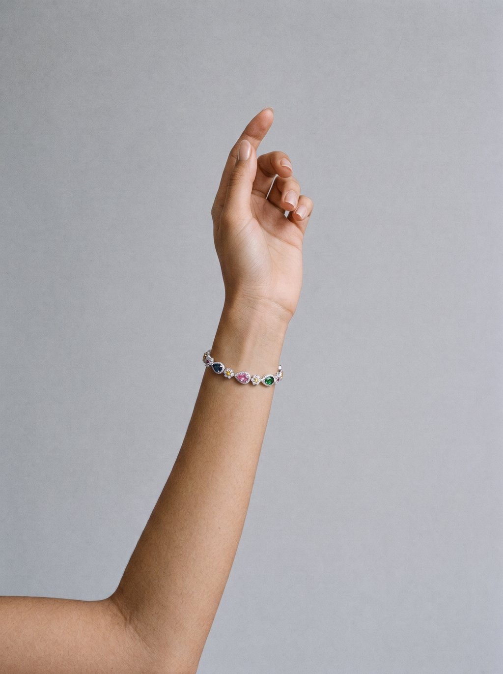 Zircon bracelet white gold colored diamonds worn on model's wrist
