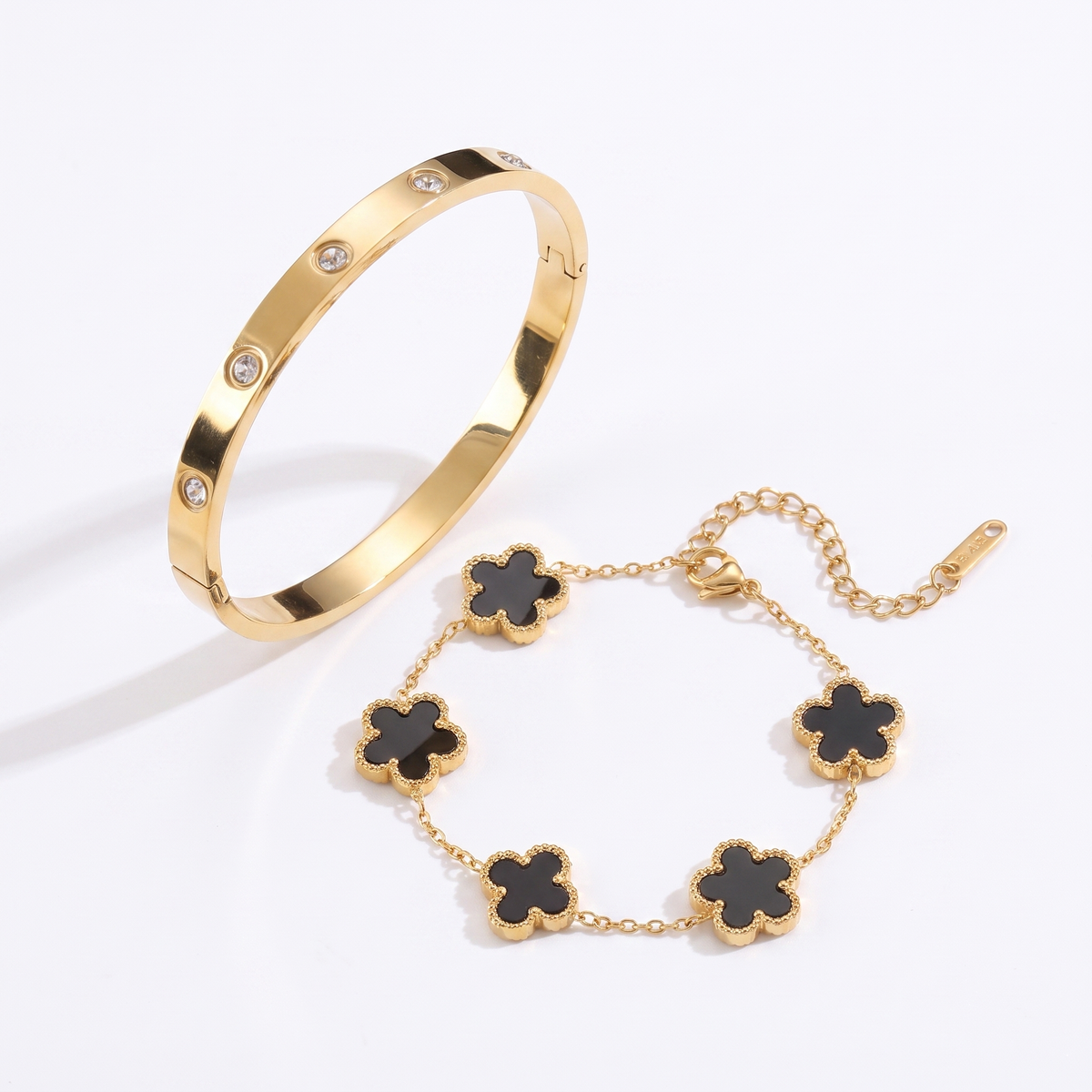 Petaline black abalone set - bangle and bracelet on white background