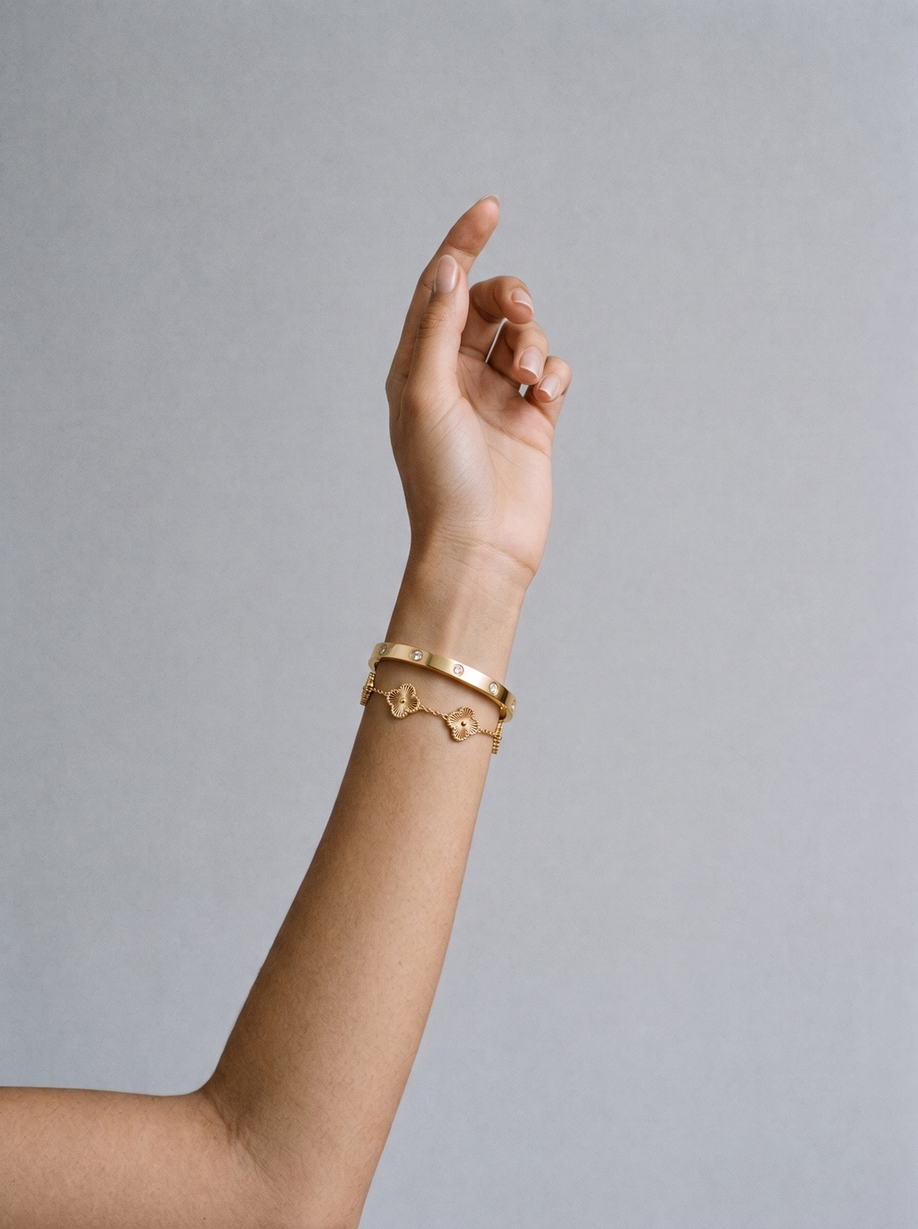Petaline gold abalone set worn on model's wrist
